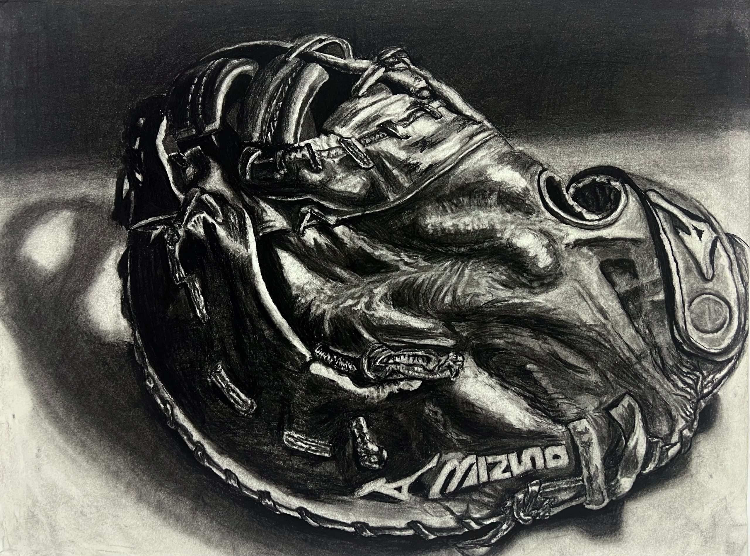 A charcoal drawing of a well-worn leather baseball glove lying on its side, the Mizuno wordmark visible on the strap, lit from the left with a soft cast shadow.